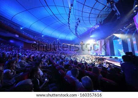 MOSCOW - MAY 25: Spectators in blue light on Russian Music Award channel RUTV in Crocus City Hall on May 25, 2013 in Moscow, Russia.