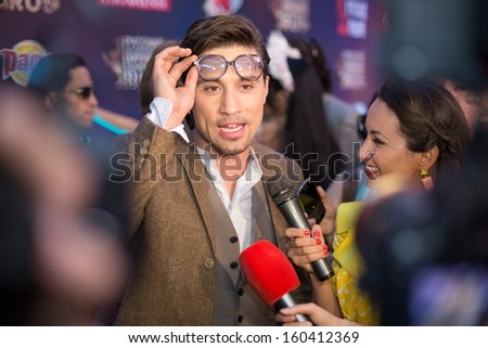 MOSCOW - MAY 25: Singer Dmitry Bilan in modern suit gives interview on Russian Music Award channel RUTV in Crocus City Hall on May 25, 2013 in Moscow, Russia.