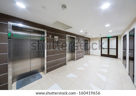 MOSCOW - MAR 14: Three chrome elevator in the hallway at home in Sokolniki on March 14, 2013 in Moscow, Russia.