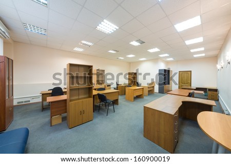 Office room with empty furniture and sofa
