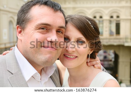 Portrait of a smiling newly married couple hugging each other