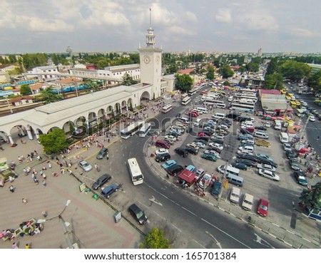 YALTA - AUG 30: A crowd of people and a large car park in front of the railway station on August 30, 2013 in Yalta, Ukraine. View from unmanned quadrocopter.