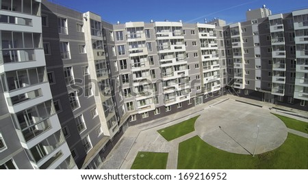 MOSCOW - OCT 12: ( UAV view)  New residential building with balcony and clear green lawn in Housing complex Romashkovo on October 12, 2013 in Mosow, Russia.