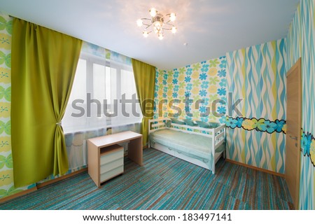 Beautiful modern children bedroom with carpet, curtains and chandelier.