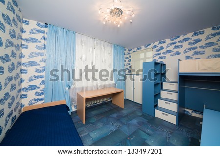 Beautiful modern children bedroom with fun wallpapers.