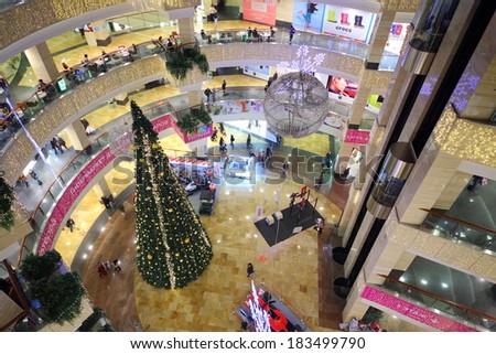 RUSSIA, MOSCOW - DEC 14, 2013: People walk at Christmas decoration shopping center Afimall with Christmas tree.