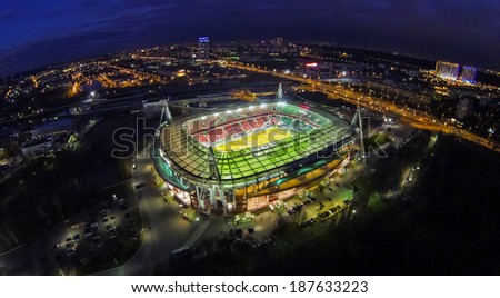 MOSCOW - OCT 21: Night view from unmanned quadrocopter to Lokomotiv Stadium with football field and city lights on horizon on October 21, 2013 in Moscow, Russia.