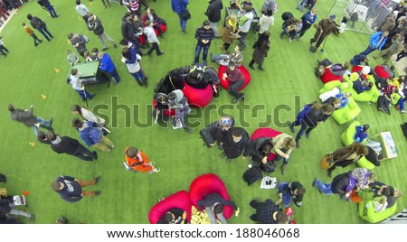 MOSCOW, RUSSIA - JAN 25, 2014: Aerial view to children and adult people at largest European festival of modern technology, science and art Geek Picnic.