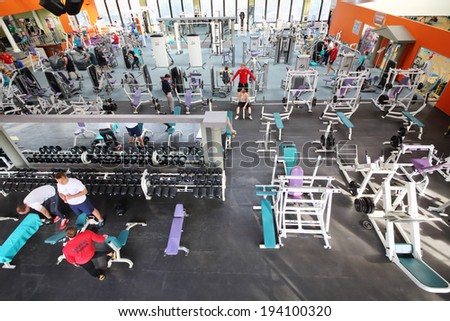 MOSCOW, RUSSIA - MAY 8, 2014: Fitness center Gold Gym with traineger equipments. In Russia, Gold Gym opened in 1996.