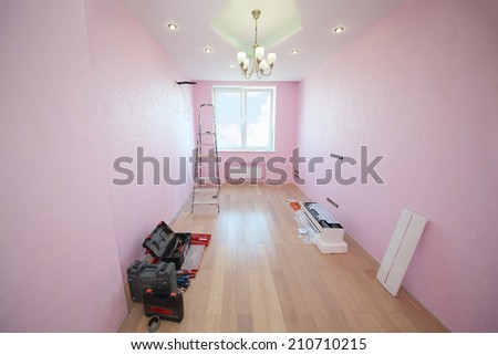 Light room with pink wallpaper prepared for the installation of air conditioning