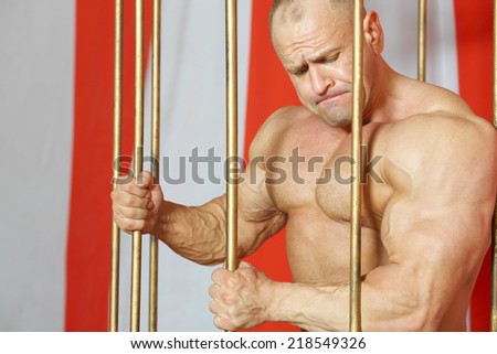 Strong athlete torn to freedom from golden cage