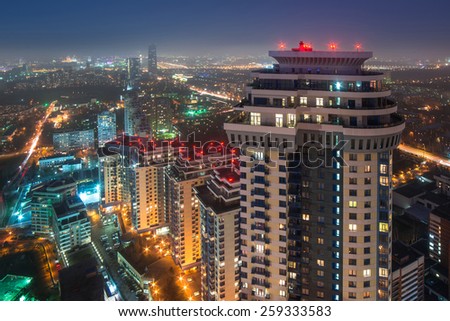 MOSCOW, RUSSIA - NOV 10, 2014: High-rise apartment complex Sparrow Hills and panorama of city. Sparrow Hills complex consists of seven buildings with a total area of 315 sq. meters