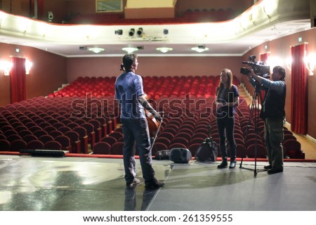 MOSCOW - MAR 12, 2014: Interview with actor of Taper-show on stage of the Palace on Yauza