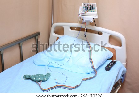 Head of the bed with a pillow and electroencephalograph in a hospital ward
