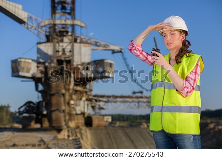 female worker looks into the distance on a background of career Stacker