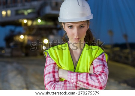 female worker closeup on rails on backgroud of career stacker
