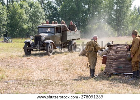 NELIDOVO, RUSSIA- JULY 12, 2014: Battlefield 2014: Soviet army truck with soldiers in the back
