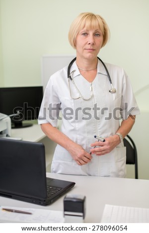 MOSCOW - JUNE 27, 2014: woman doctor in her office in Scientific-practical center of medical care for children with developmental disabilities, craniofacial and congenital diseases of nervous system