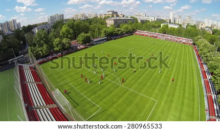 RUSSIA, BOGORODSKOE  - MAY 14, 2014: Soccer teams play on field of Spartakovec stadium named by N.P. Starostin during international competition. Aerial view