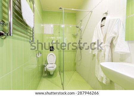 ADLER, RUSSIA - JULY 22, 2014: Interior of a green  hotel room bathroom in Shine House hotel