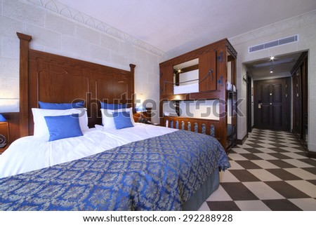 SOCHI, RUSSIA - JUL 27, 2014: Interior of superior room with a double bed and a bunk bed in the Hotel Bogatyr