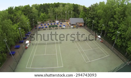 RUSSIA, MOSCOW - MAY 17, 2014: Two men play table tennis near courts in park Sokolniki at spring day. Aerial view