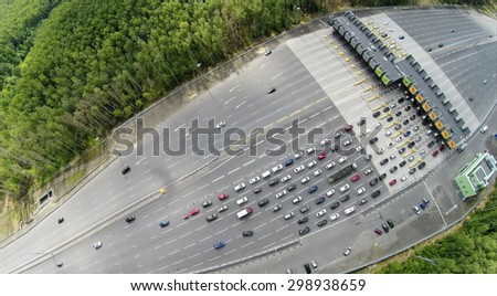 RUSSIA, MOSCOW - JUL 5, 2014: Top view of traffic on road at summer day. Aerial view. Photo with noise from action camera. Photo with noise from action camera
