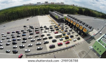 RUSSIA, MOSCOW - JUL 5, 2014: Car traffic near fee. Aerial view. Photo with noise from action camera. Photo with noise from action camera