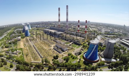 RUSSIA, MOSCOW - JUL 14, 2014: Cityscape with power plant at sunny summer day. Aerial view. Photo with noise from action camera.