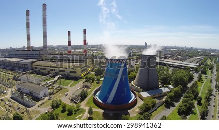 RUSSIA, MOSCOW - JUL 14, 2014: Electricity station at summer sunny day. Aerial view. Photo with noise from action camera.