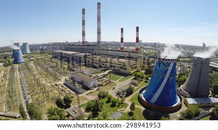 RUSSIA, MOSCOW - JUL 14, 2014: Electric power station in city at sunny summer day. Aerial view. Photo with noise from action camera.