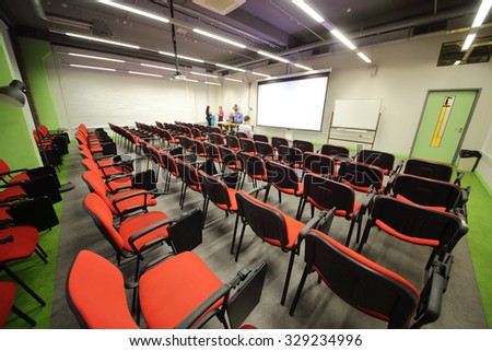RUSSIA, MOSCOW - 07 DEC, 2014: Meeting business room with auditorium and people talk at British Higher School of Art and Design.