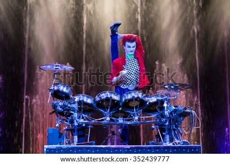 RUSSIA, MOSCOW - 18 DEC, 2014: Performer is playing on the drum kit on stage at Aquamarine circus.