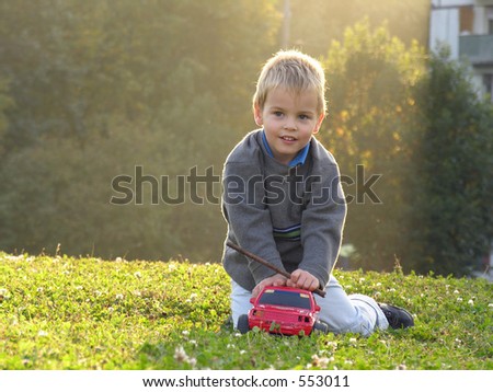 child play with car on sunset light