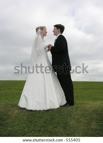 wedding face to face on grass and clouds