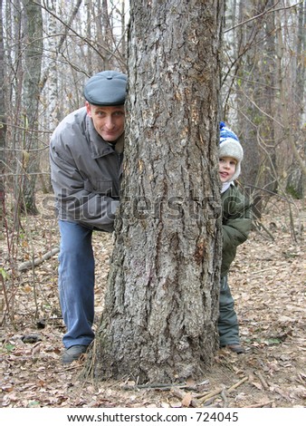 grandfather and grandson play hide-and-seek