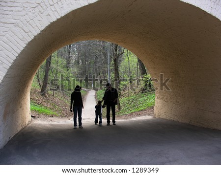 family in arch from spring wood