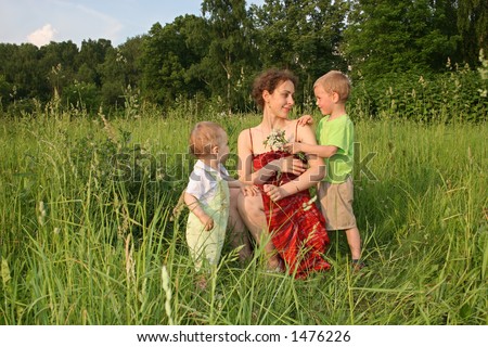 children give mother flowers