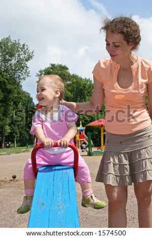 Child On Seesaw