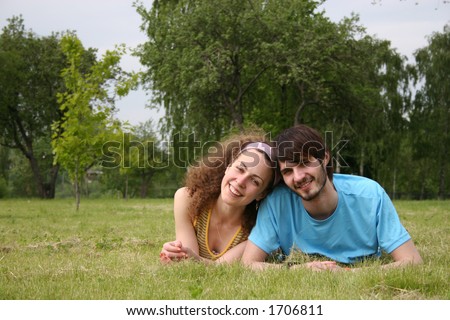 couple falling in love on grass