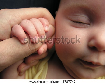 baby sleep with father\'s finger