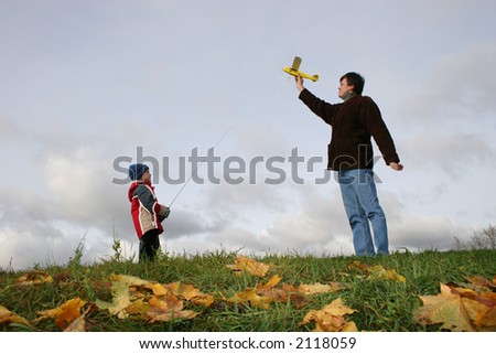 autumn father with son and plane