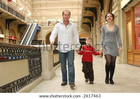 family walking in shop