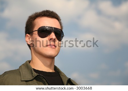 man with glasses on sky
