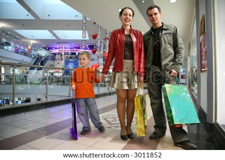 family with boy in shop