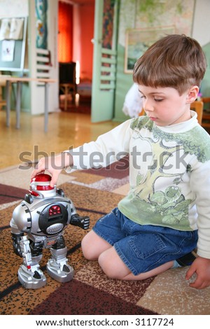 sad child alone with robot in kindergarten
