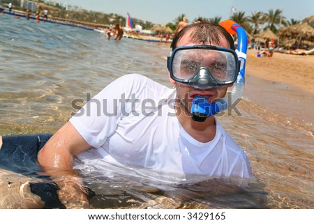 Man with snorkel in mouth