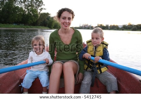 mother and child in the boat in the lake 2