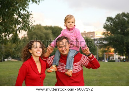family with the daughter, who sits on the shoulders of the father 2