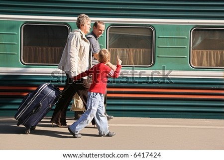 grandmother and grandfather with the grandson on station